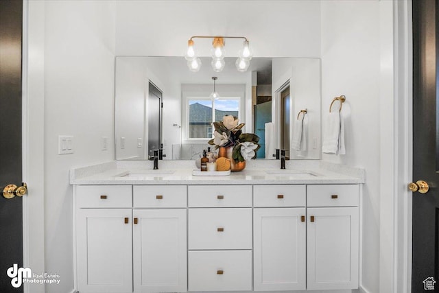 bathroom featuring double vanity and a sink