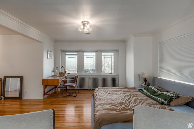 381 E 11th Ave, Salt Lake City, UT 84103 - bedroom featuring crown molding, wood finished floors, and radiator heating unit