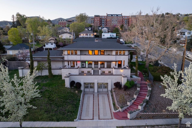 381 E 11th Ave, Salt Lake City, UT 84103 - back of house with stucco siding, a residential view, stairs, and a balcony