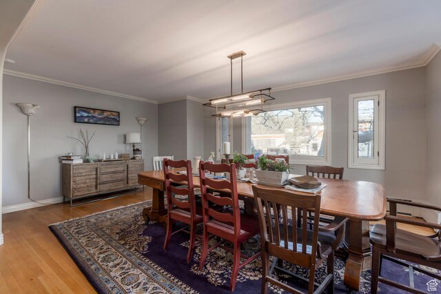 381 E 11th Ave, Salt Lake City, UT 84103 - dining room with wood finished floors, crown molding, and baseboards