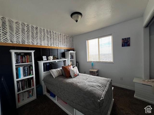 1115 Park Ridge Dr, Roosevelt, UT 84066 - bedroom featuring baseboards and dark colored carpet