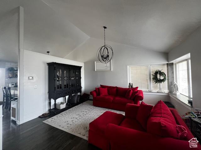 1115 Park Ridge Dr, Roosevelt, UT 84066 - living room featuring vaulted ceiling, a chandelier, wood finished floors, and baseboards