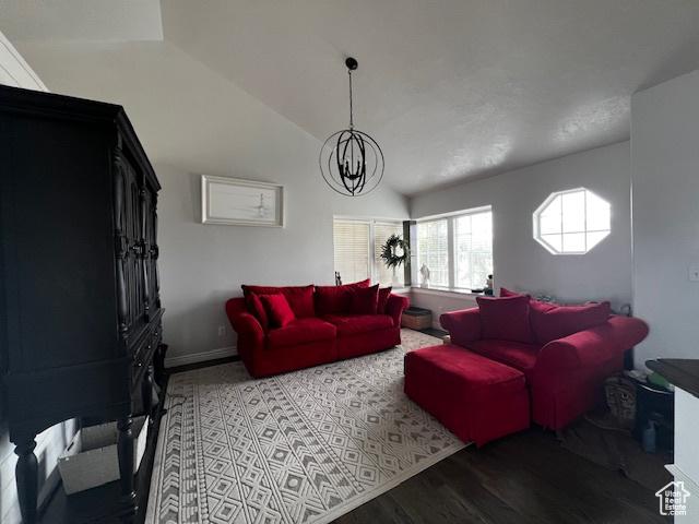 1115 Park Ridge Dr, Roosevelt, UT 84066 - living area with vaulted ceiling, wood finished floors, and a notable chandelier