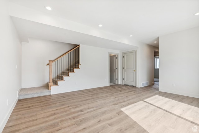 178 N Husker Ln Unit 2, Saratoga Springs, UT 84043 - unfurnished living room featuring recessed lighting, light wood-style floors, baseboards, and stairs