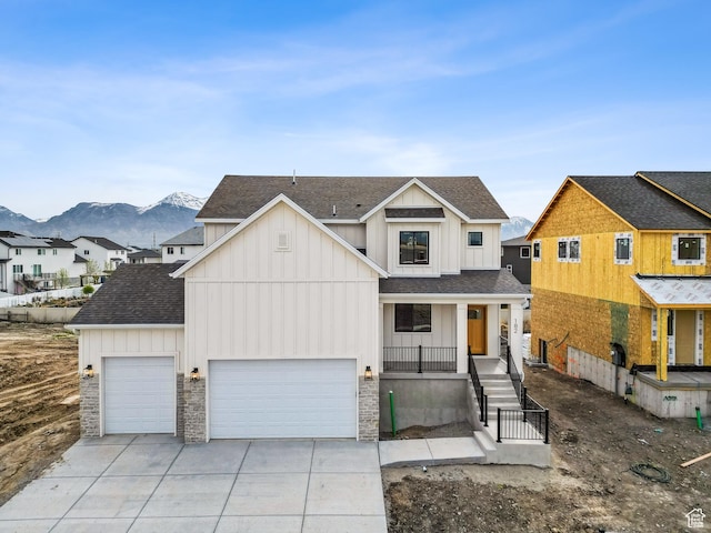 modern farmhouse style home with board and batten siding, a shingled roof, concrete driveway, and a garage
