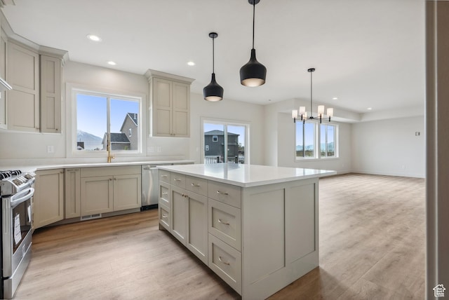 178 N Husker Ln Unit 2, Saratoga Springs, UT 84043 - kitchen with a healthy amount of sunlight, stainless steel appliances, and light countertops