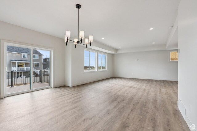 178 N Husker Ln Unit 2, Saratoga Springs, UT 84043 - empty room featuring baseboards, wood finished floors, recessed lighting, and a chandelier