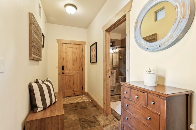 2605 E Woodland Way, Woodland, UT 84036 - entryway featuring baseboards and dark stone finish flooring