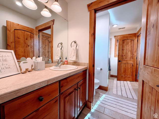 2605 E Woodland Way, Woodland, UT 84036 - bathroom with tile patterned floors, vanity, and toilet