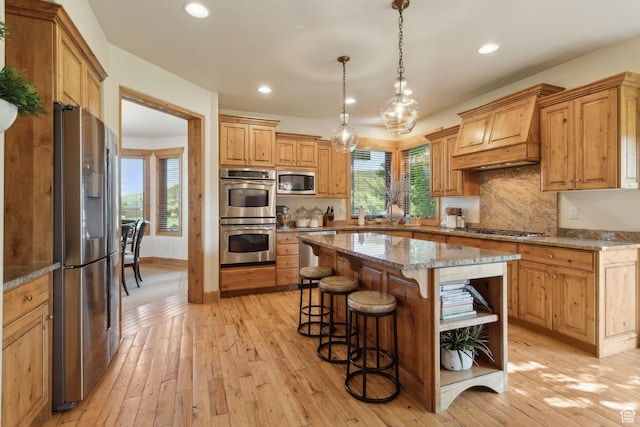 2605 E Woodland Way, Woodland, UT 84036 - kitchen with stainless steel appliances, open shelves, a breakfast bar, custom exhaust hood, and light wood-type flooring