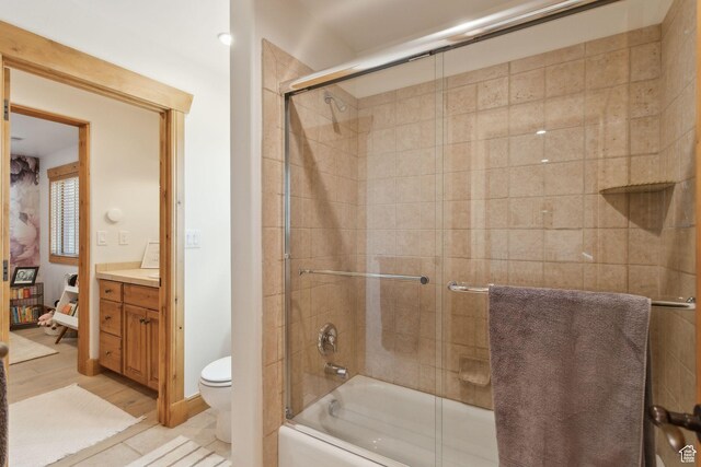 2605 E Woodland Way, Woodland, UT 84036 - bathroom featuring vanity, toilet, enclosed tub / shower combo, and wood finished floors