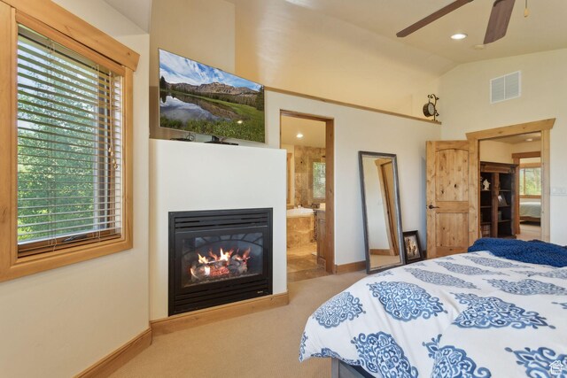 2605 E Woodland Way, Woodland, UT 84036 - carpeted bedroom featuring baseboards, vaulted ceiling, multiple windows, ensuite bathroom, and a glass covered fireplace