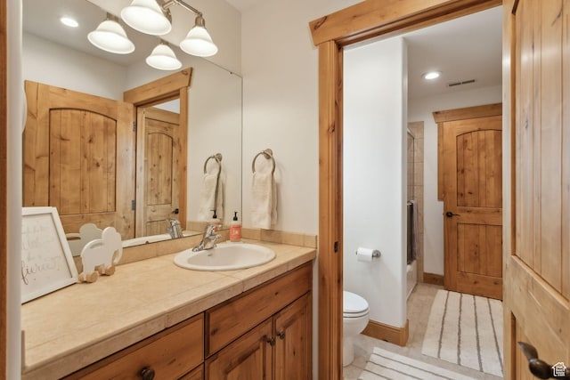 2605 E Woodland Way, Woodland, UT 84036 - bathroom featuring toilet, vanity, bath / shower combo with glass door, tile patterned flooring, and recessed lighting