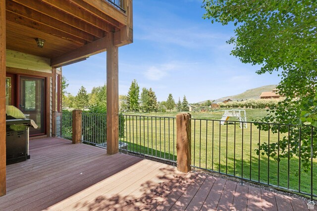 2605 E Woodland Way, Woodland, UT 84036 - wooden terrace featuring a lawn and a mountain view