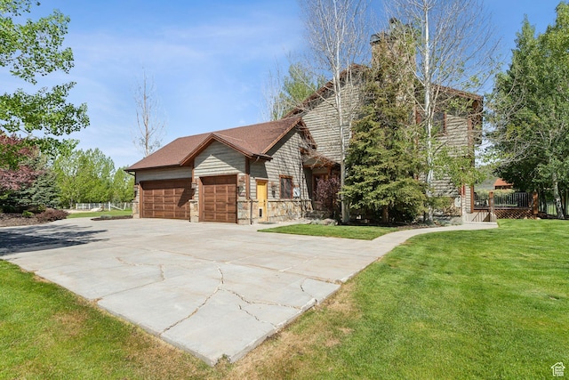 2605 E Woodland Way, Woodland, UT 84036 - view of front of property featuring a front yard, concrete driveway, a garage, and a chimney