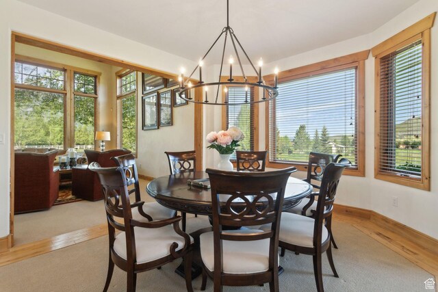 2605 E Woodland Way, Woodland, UT 84036 - dining room featuring light wood-style flooring, a chandelier, and baseboards