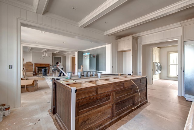 kitchen featuring crown molding, white cabinetry, beamed ceiling, stainless steel built in refrigerator, and a notable chandelier