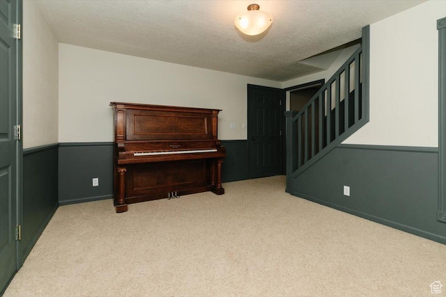 770 Orchard Dr, River Heights, UT 84321 - interior space featuring carpet floors, a textured ceiling, and stairway