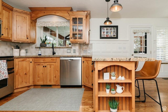 770 Orchard Dr, River Heights, UT 84321 - kitchen with backsplash, stainless steel dishwasher, stove, and plenty of natural light