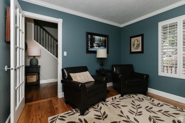 770 Orchard Dr, River Heights, UT 84321 - sitting room featuring baseboards, wood finished floors, stairs, and ornamental molding