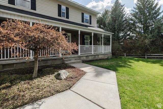 770 Orchard Dr, River Heights, UT 84321 - entrance to property with fence, covered porch, and a yard