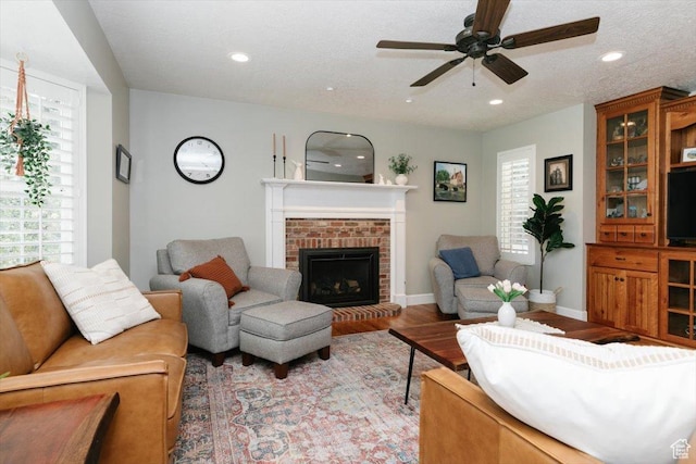 770 Orchard Dr, River Heights, UT 84321 - living room with wood finished floors, a fireplace, recessed lighting, and ceiling fan