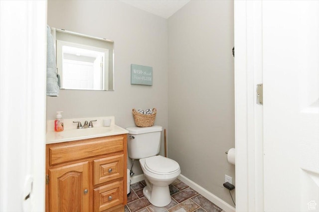 770 Orchard Dr, River Heights, UT 84321 - half bath featuring baseboards, vanity, and toilet