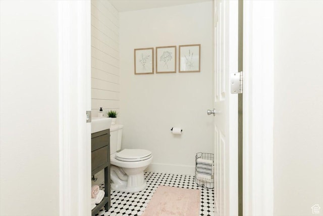 770 Orchard Dr, River Heights, UT 84321 - half bath with tile patterned floors, baseboards, vanity, and toilet