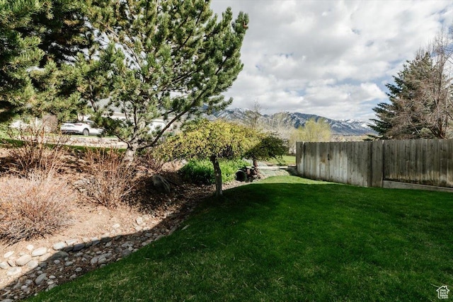 770 Orchard Dr, River Heights, UT 84321 - view of yard featuring fence and a mountain view
