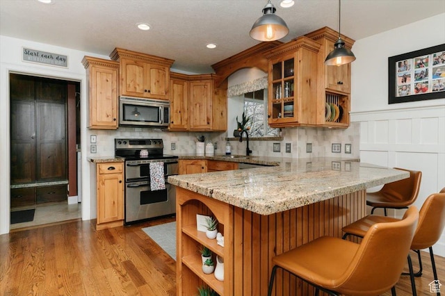 770 Orchard Dr, River Heights, UT 84321 - kitchen with open shelves, stainless steel appliances, a peninsula, and a sink