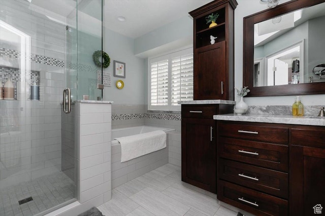 770 Orchard Dr, River Heights, UT 84321 - bathroom with a bath, a shower stall, tile patterned floors, and vanity