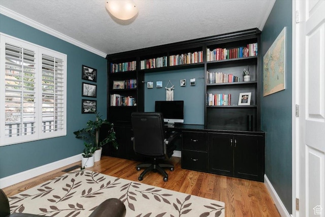 770 Orchard Dr, River Heights, UT 84321 - office area with wood finished floors, a textured ceiling, crown molding, and baseboards