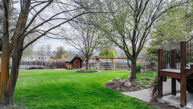 770 Orchard Dr, River Heights, UT 84321 - view of yard featuring a fenced backyard, an outbuilding, and a storage shed