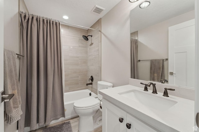 bathroom with vanity, shower / tub combo, toilet, visible vents, and recessed lighting