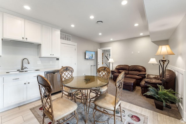 dining area featuring recessed lighting, light wood-style floors, and visible vents