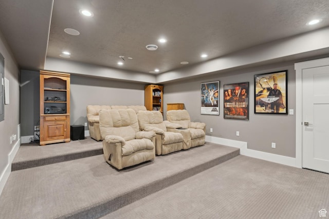 carpeted cinema room featuring baseboards and recessed lighting