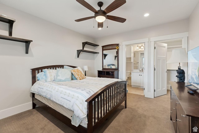 bedroom featuring a ceiling fan, connected bathroom, light colored carpet, baseboards, and recessed lighting