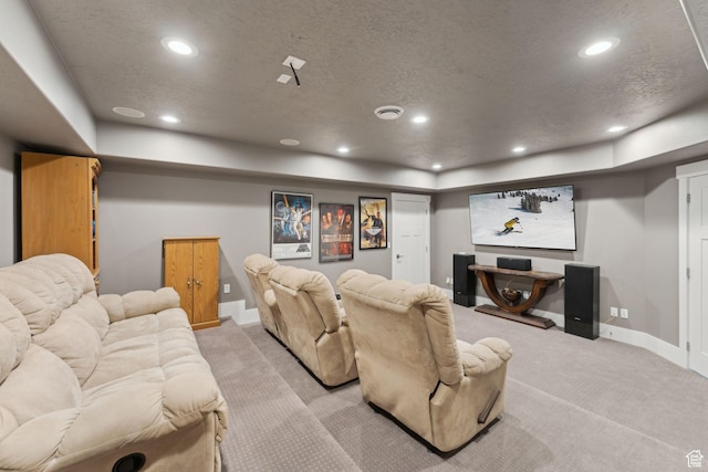 cinema with baseboards, recessed lighting, a textured ceiling, and light colored carpet
