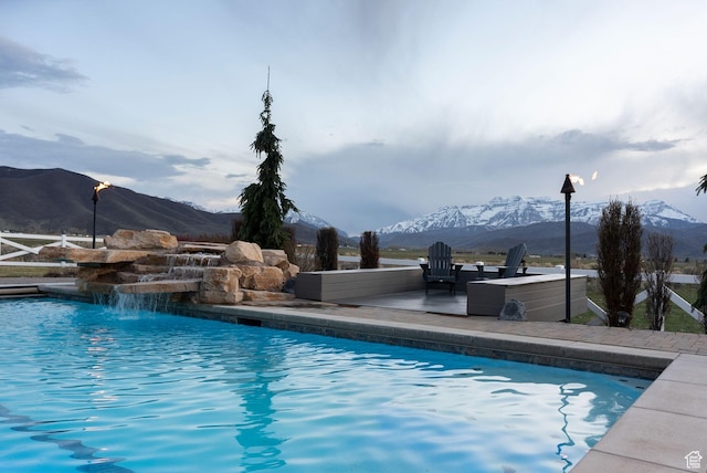 outdoor pool featuring a mountain view