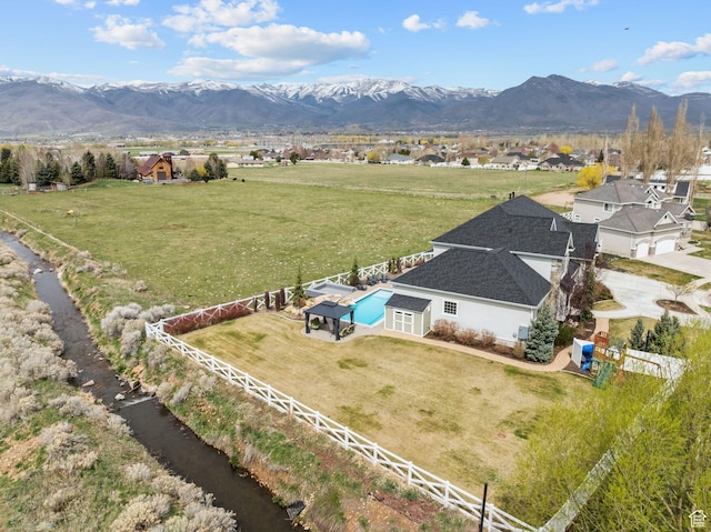 birds eye view of property featuring a mountain view