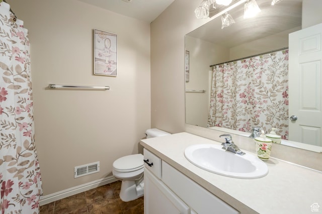 1426 N Quincy Ave, Ogden, UT 84404 - bathroom with baseboards, visible vents, vanity, and toilet
