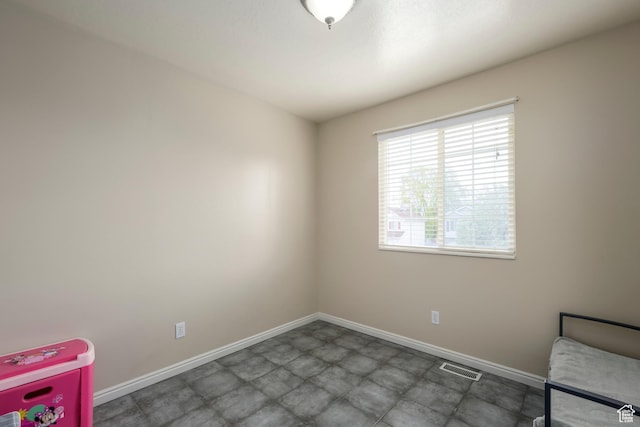 1426 N Quincy Ave, Ogden, UT 84404 - unfurnished bedroom featuring baseboards and visible vents