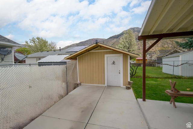 1426 N Quincy Ave, Ogden, UT 84404 - view of shed featuring a fenced backyard and a mountain view