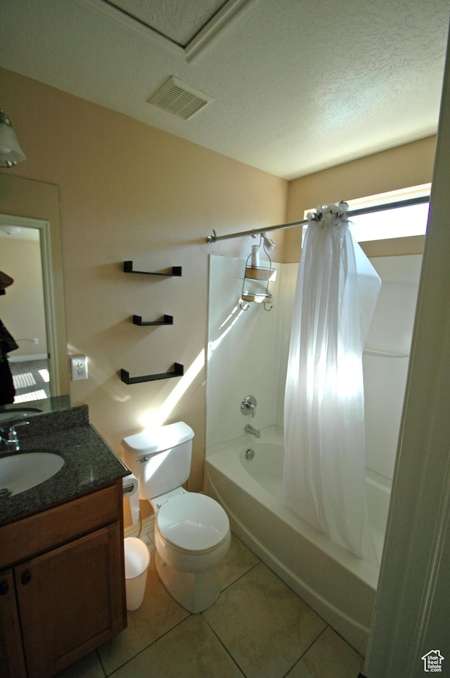 full bathroom featuring toilet, vanity, visible vents, tile patterned floors, and shower / bathtub combination with curtain