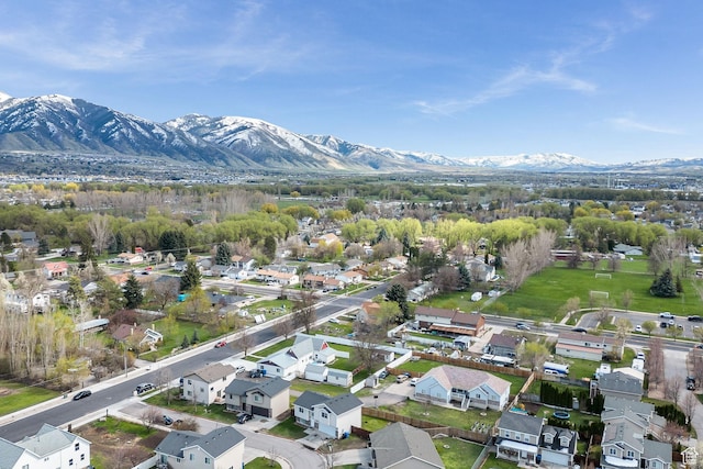 818 W 530 S, Logan, UT 84321 - aerial view of property and surrounding area featuring mountains and nearby suburban area