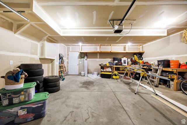 818 W 530 S, Logan, UT 84321 - garage with a garage door opener and a workshop area