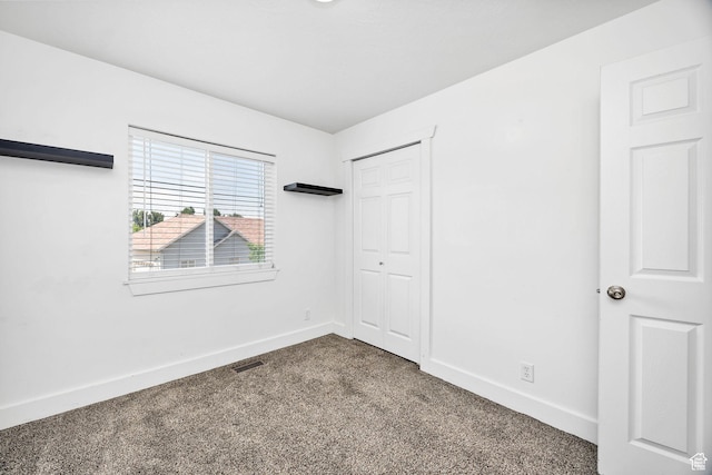 818 W 530 S, Logan, UT 84321 - unfurnished bedroom featuring carpet floors and a closet