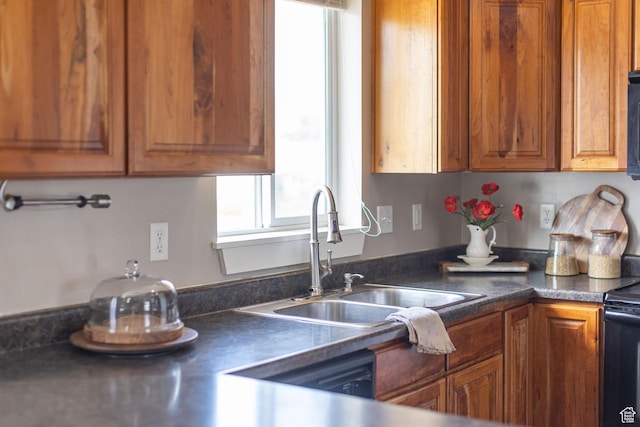 818 W 530 S, Logan, UT 84321 - kitchen featuring healthy amount of natural light, brown cabinets, black electric range oven, and dark countertops