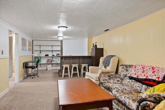 living room with carpet floors and visible vents