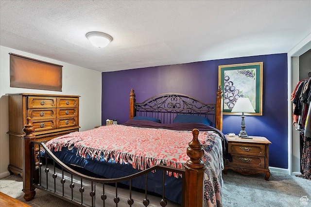 carpeted bedroom featuring baseboards